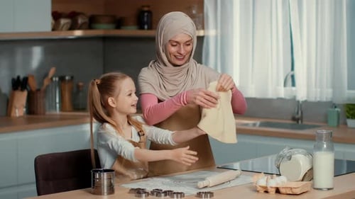 Mother and Daughter Baking in a Bright Kitchen During the Day