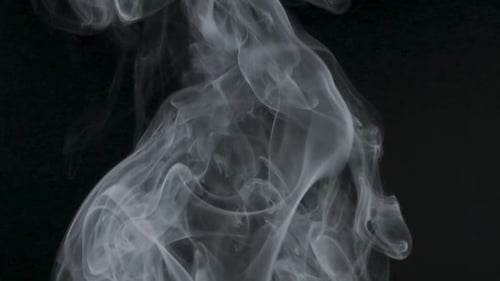 Abstract Smoke Drifting on Black Background