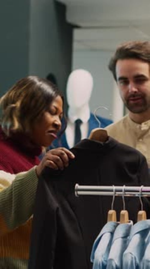 Woman Shopping for Clothes with Shop Assistant
