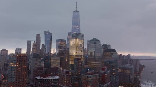 Aerial View Capturing One World Trade Center Towering Over Illuminated Lower Manhattan Skyline