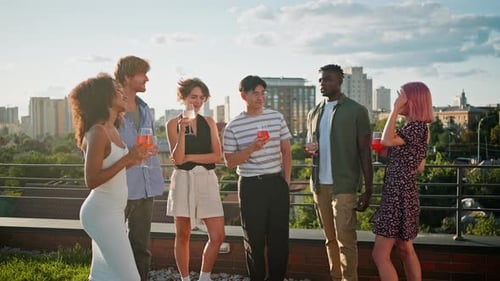 Multiracial Friends Having Party on Rooftop with Drinks