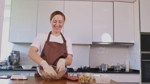 Woman Baking in Her Modern Kitchen