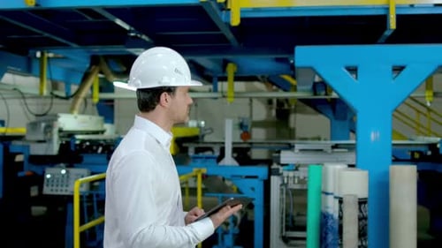 Industrial Worker Engineer Man with Tablet at Factory Heavy Machine Metal Manufacturing Equipment