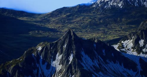 Majestic Mountain Peak Rises Above Lush Green Valley Landscape