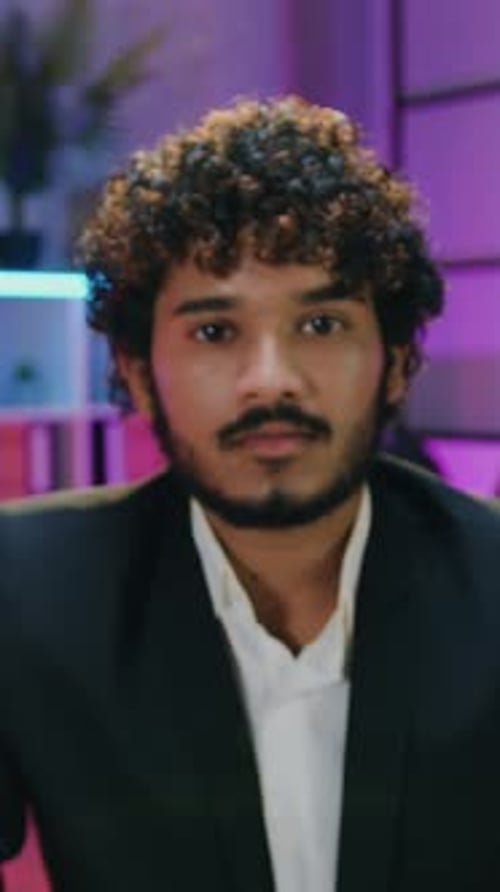 Portrait of Attractive Goodnatured Successful Curly Bearded Muslim or Indian Office Manager in