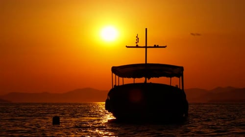 Boat Silhouette at Sunset on the Ocean