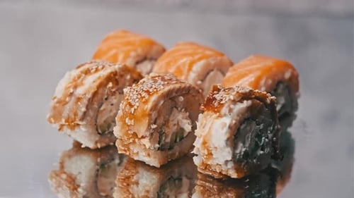Sushi Rotates on a Mirror Table