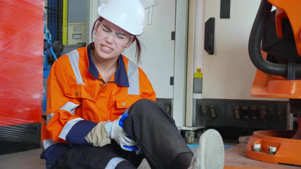 Young asian engineer woman injury with leg in factory industrial ...