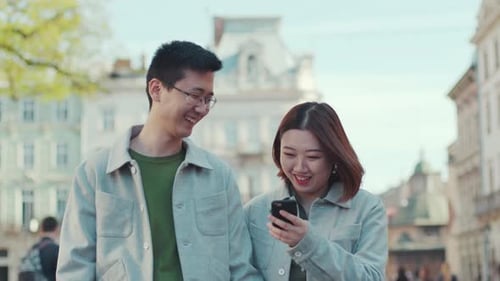 Young Asian Couple Walk Together Talk Use Phone Smile Feel Happy in City Center Business Woman Love