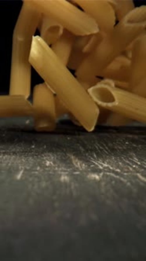 Dry Pasta Falls on the Table Filmed on a Highspeed Camera at 1000 Fps
