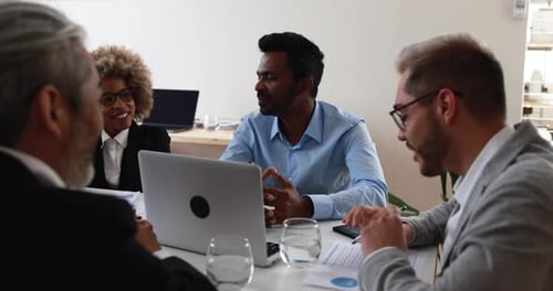 Multiracial business team collaboration on startup strategy inside a bank office