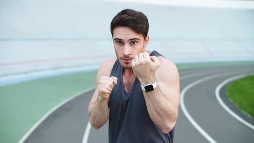 Man Boxer Exercising at Stadium. Sport Man Boxing in Outdoor