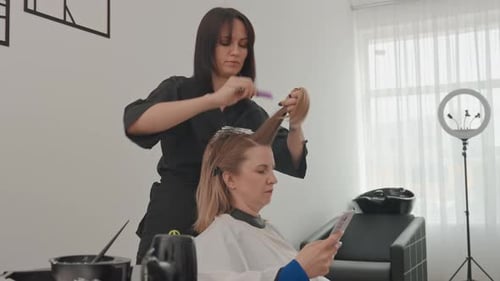 Woman Getting Hair Colored at Hair Salon