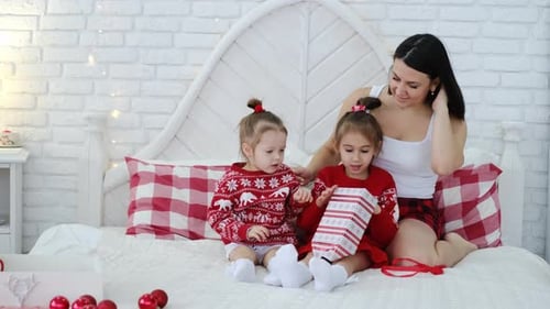 Festive Family Opening Gifts on Christmas Morning