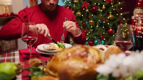 Man Eating Christmas Dinner at Home