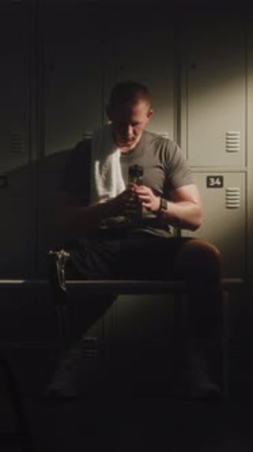 Recovery of Young Man with Bionic Leg in Locker Room