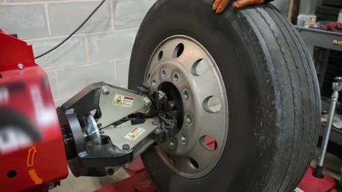 Wheel Balancing or Repair and Change Car Truck Tire at Auto Service Garage or Workshop By Mechanic