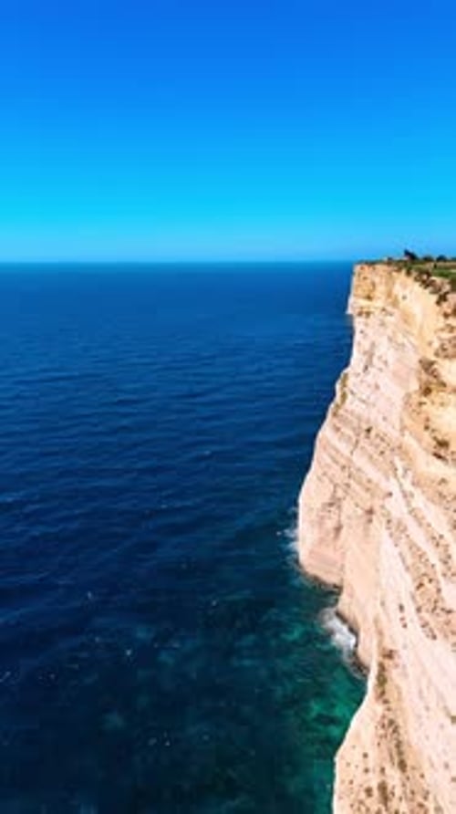 White cliffs and amazing blue waterscape. Picturesque scenery of the shore in Malta, Europe.