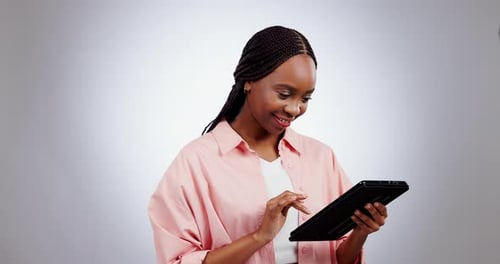 Woman, tablet and smile in studio with internet, social media update or search funny meme on white