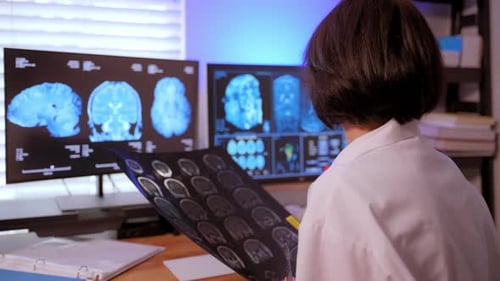 Adult Analyzing Brain Scan in a Medical Workplace