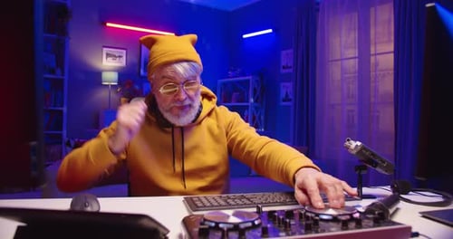 Senior Man Creating Music at DJ Mixer