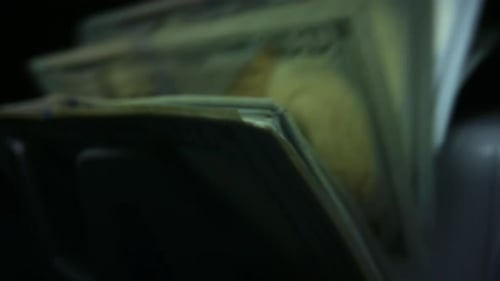 Closeup Money Counting Machine. Counting Us Dollar Banknotes in Currency Counter Machine