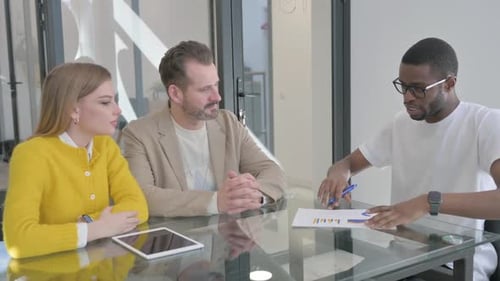 Team Discussing Business at a Conference Table