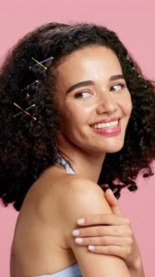 Beauty, smile and shoulder of woman in studio for salon, self care and shine