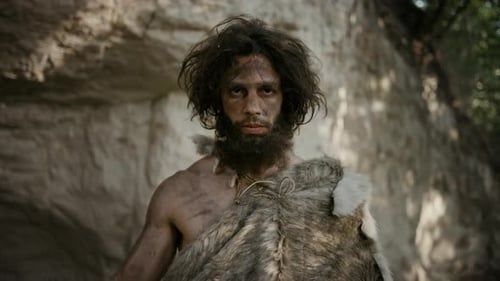 Man in Fur Costume Holding Primitive Hammer