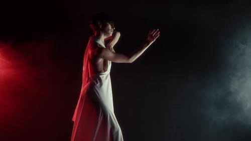 Gorgeous Woman in Silk Dress Performs Modern Choreography Contemporary Style Dance with Arms in Neon