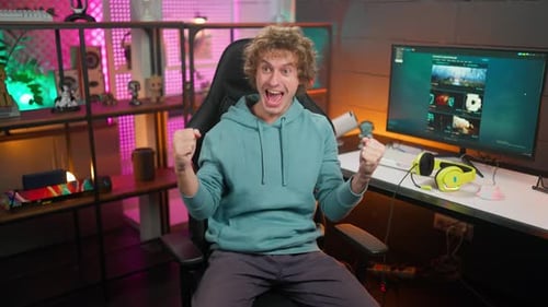 Excited Young Man Celebrating Gaming Success