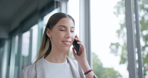 Young Woman Chatting on Phone Indoors