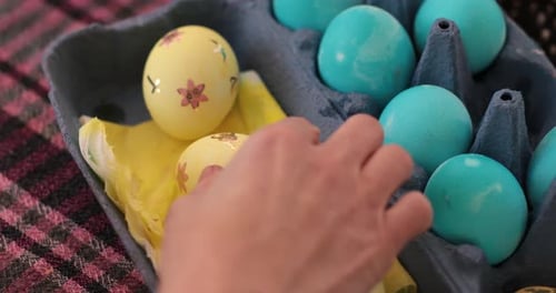 Step of Egg Painting Process Featuring Yellow Blue Easter Eggs Adorned with Stickers for Festive