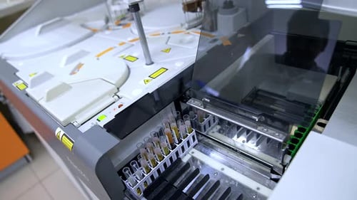 Modern advanced equipment performing science testing of blood in the hospital laboratory.
