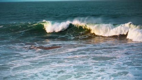 White Sea Waves Rolling Seashore on Sunny Day