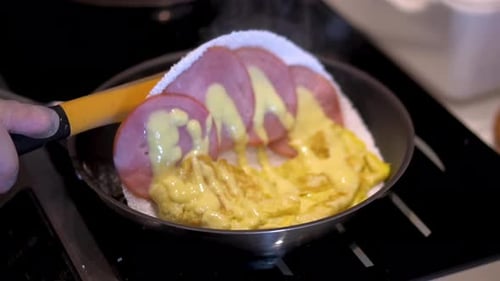 Preparing a Tapioca Crepe with Ham and Cheese