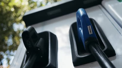 A Modern Electric Vehicle Charging Station Strategically Located in an Urban Setting for Convenience