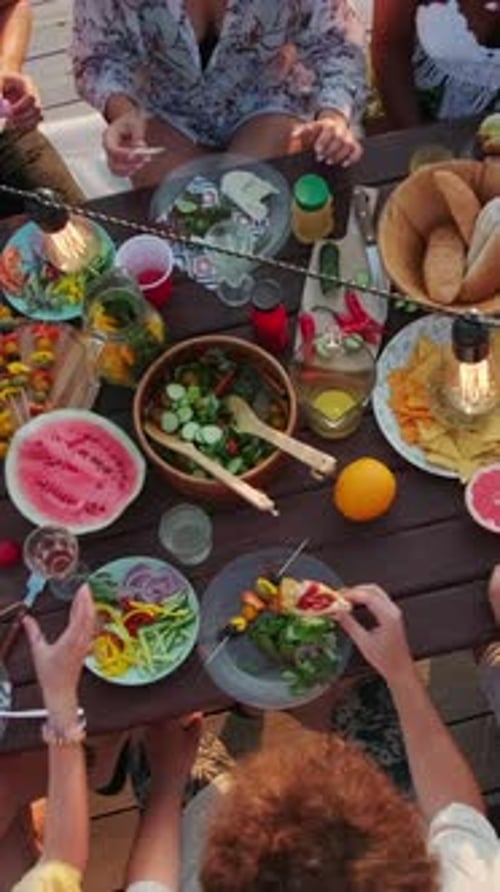 Overhead Shot of Friends Eating Colorful Healthy Lunch