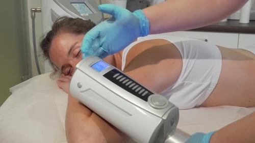 Woman Receives Cosmetic Facial Treatment With Device