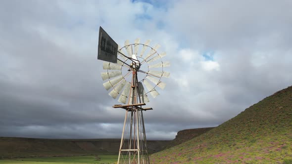 Windpump on a farm in the Northern Cape, South Africa, under cloudy ...