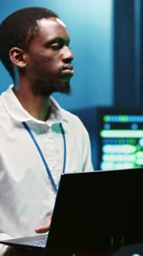 Vertical Frame Computer Scientist Repairs Server Network Performance Issues