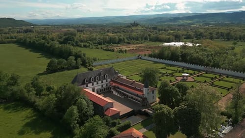 aerial shot above the Bastie d'Urfe castle in Forez plain on a sunny day in loire departement, auver