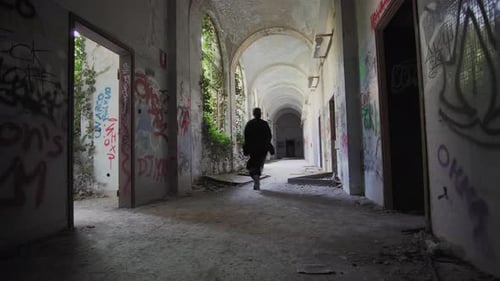 girl run in abandoned place.violence against women concept