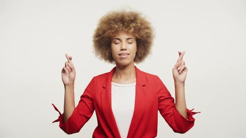 Woman Crossing Fingers for Good Luck and Hope