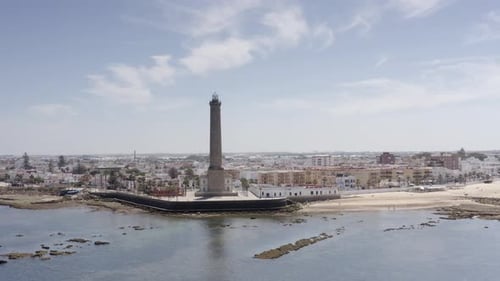 Aerial view over large Lighthouse in Chipiona, spain