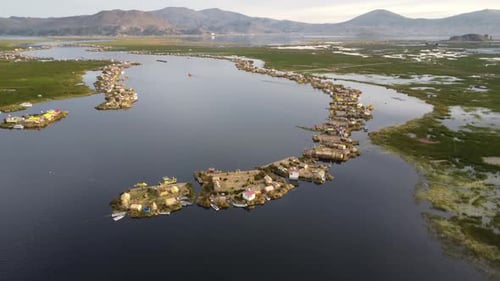 Drone shot of floating villages on Lake Titicaca in Peru.