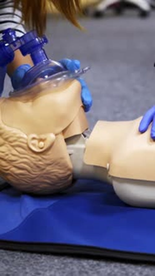 Training compression on a dummy. CPR exercise on a mannequin in the medical center. T