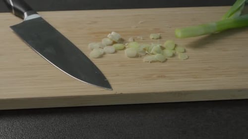 Close Up of Cut Scallions and Knife