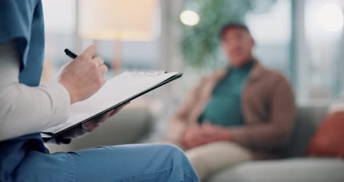 Medical Consultation with Doctor Taking Notes