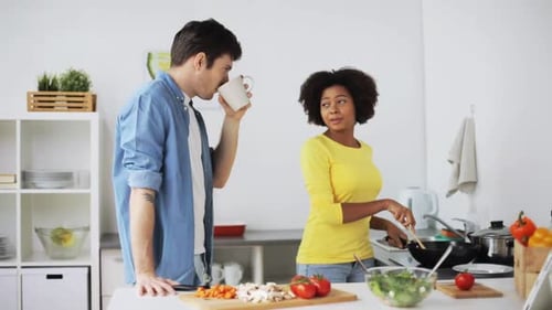 Couple Cooking Together in Bright Kitchen